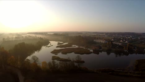 Foggy-sunrise-over-the-river.-Scenic-aerial-footage-1