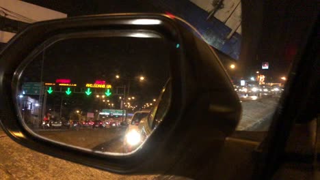 Night-shot-of-a-view-through-the-car-mirror