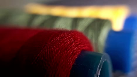 Spools-of-Yellow,-Green-and-Red-Yarn