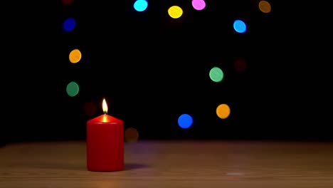 A-christmas-candle-with-bokeh-background