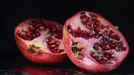 The-Light-Moves-To-The-Right-Of-The-Pomegranate-On-Black-Background