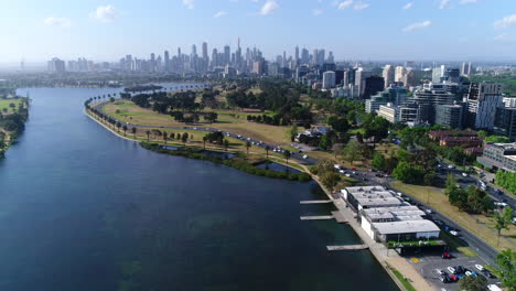 Drone-over-Albert-Park,-Melbourne-City-in-background