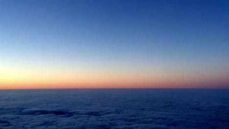 Sunrise-and-clouds,-view-from-a-plane