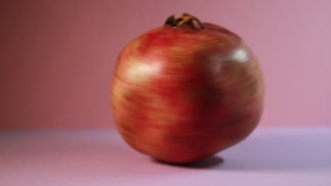 Pomegranate-In-Fast-Rotation.-Close-Up-Studio-Shot
