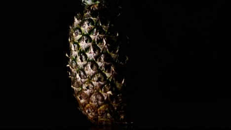 Sweet-Comosus-Pineapple-Ananas-Turning-On-a-Black-Background-2