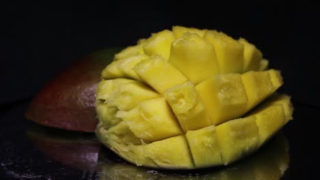 Sliced-Mango-On-a-Black-Background.-Close-Up-Footage