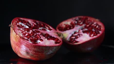 The-Light-Moves-To-The-Left-Of-The-Pomegranate-On-Black-Background