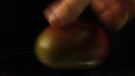Close-Up-Of-Spinning-Mango-Fruit-On-a-Black-Background-1