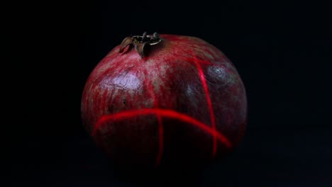 Lots-Of-Laser-Light-Scans-The-Pomegranate-Fruit-In-The-Dark