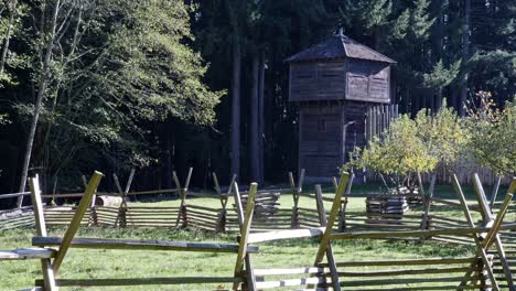 Look-through-the-livestock-pen-to-Fort-Nisqually-on-a-sunny-day-in-Washington-State