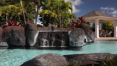 Slow-track-to-pool-side-waterfall-and-tropical-plants