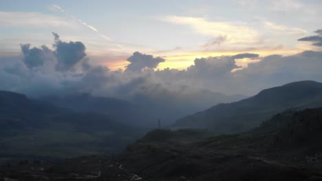 Aerial-clip-of-a-cloudy-sunset-in-the-landscape-of-the-Maniva-pre-alps,-Lombardia,-Italy