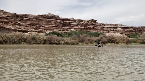 Pan-of-guys-paddling-canoe-on-river-in-Utah