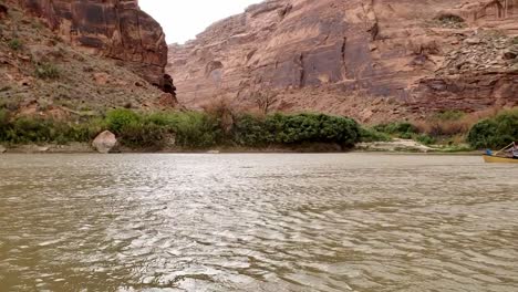Guys-canoeing-down-river-in-Utah