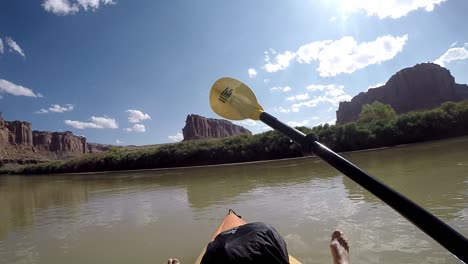 First-person-view-floating-on-river-and-swinging-paddle-in-Utah