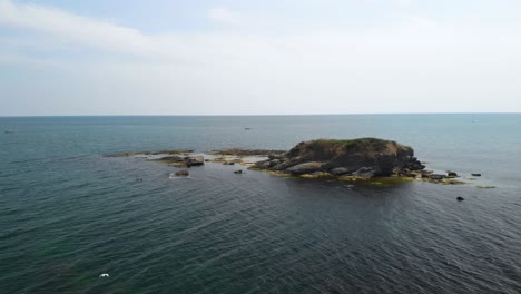 Drone-panoramic-footage-around-small-island-in-Black-sea,-Bulgaria