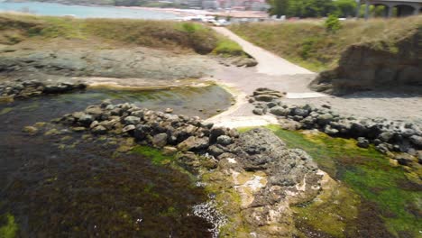 Fast-aerial-shot---drone-drift-around-seashore-rocky-coast