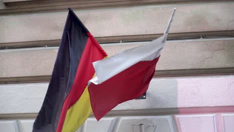 German-and-polish-flags-waving-on-wind