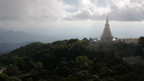 Footage-of-drone-flying-over-the-Temple-Doi-Inthanon-in-Chiang-Mai-in-Thailand-with-the-ocean-bellow-in-the-backgroung-2