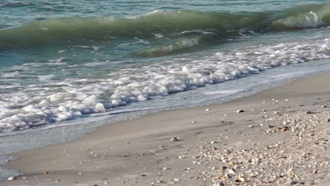 Slow-motion-gentle-gulf-waves-in-soft-sunlight-on-white-sandy-beach-in-Boca-Grande