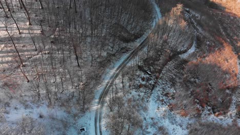 Aerial-shot-of-snowy-mountain-road-3