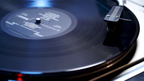 Vinyl-recorder-playing-in-blue-light