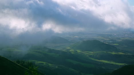 A-dramatic-cinematic-shot-with-the-Clouds-covering-the-beautiful-green-hills-of-the-Azores-Island