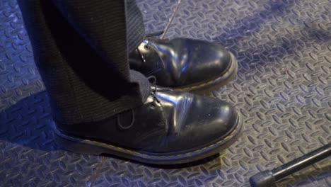 Musician-dancing-on-stage-,-close-up-shot-of-his-shoes