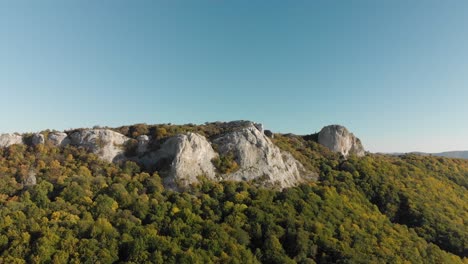 Aerial-panning-shot-around-high-mountain-cliffs-1