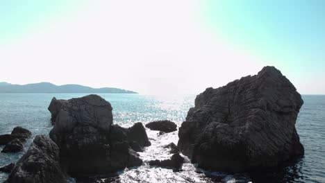 Low-drone-shot-of-sea-rocks-close-to-seashore-1