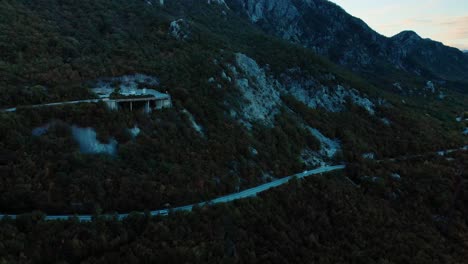 Aerial-medium-shot-of-mountain-road-after-sunset-10