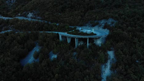 Aerial-medium-shot-of-mountain-road-after-sunset-5