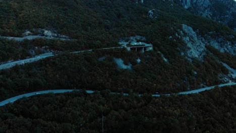 Aerial-medium-shot-of-mountain-road-after-sunset-11