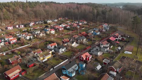 Aerial-footage-of-some-beautiful-picturesque-cottages-in-Delsjon,-Gothenburg,-Sweden-2