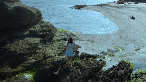 Pretty-girl-in-white-dress-walk-on-the-beach-in-slow-motion-1