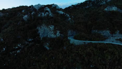 Aerial-medium-shot-of-mountain-road-after-sunset-9