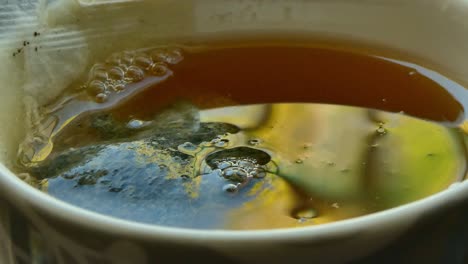 Close-up-of-water-falling-in-a-cup-of-tea