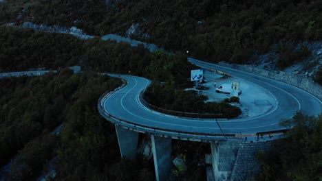 Aerial-medium-shot-of-mountain-road-after-sunset-6