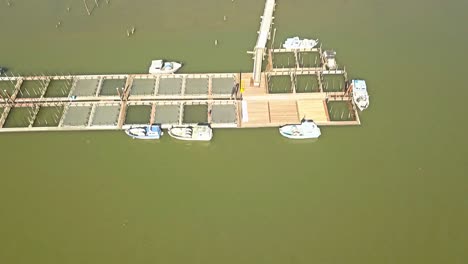 Aerial-drone-view-over-boat-docks-in-slough