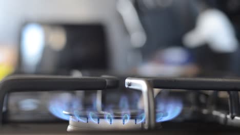 Turning-gas-stove-on-with-flame