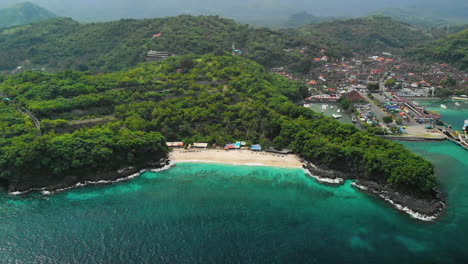 Wide-aerial-overview-of-the-Bias-Tugel-Beach-and-Padang-Bai-Port,-East-Bali