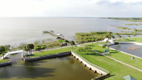 Pan-Out-Flying-Over-Beautiful-Florida-Lakeside-Dock-on-Lake-Apopka