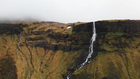 Acending-aerial-footage-of-the-giant-waterfall-Bjarnarfoss-which-is-located-in-Iceland