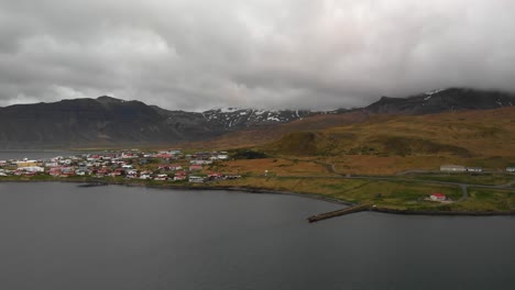 Aerial-footage-showing-the-small-town-called-grundarfjordur-located-in-Iceland-very-close-to-mount-kirkjufell