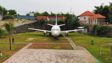 Aerial-video-of-an-abandoned-airplane-on-the-island-of-Bali,-Indonesia
