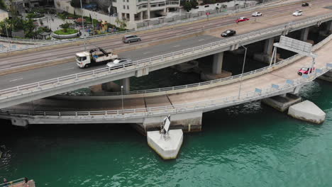 Aerial-footage-of-express-way-traffic-above-water