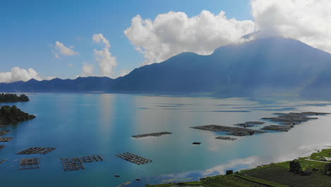 Aerial-footage-of-Danau-Batur-lake-and-active-volcano-Mount-Batur