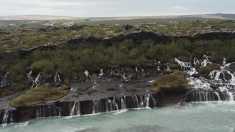 Panning-footage-over-beautiful-waterfall-Barnafoss-located-in-Iceland,-Europe