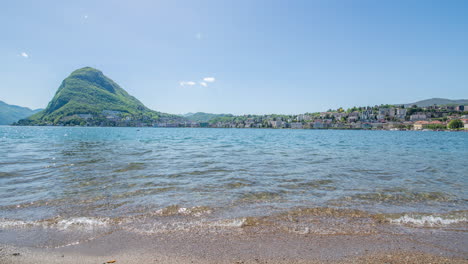 Time-lapse-of-the-Lugano's-beach,-wave-after-wave