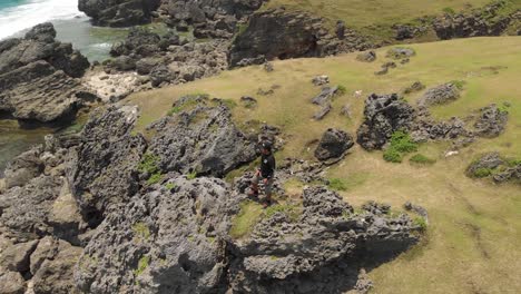 A-man-standing-on-top-of-a-rock-in-Batanes